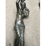 A bronze in the form of a semi nude maiden of classical form 58 cm
