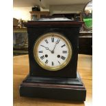 A Victorian black slate and Italian red marble mantle clock.