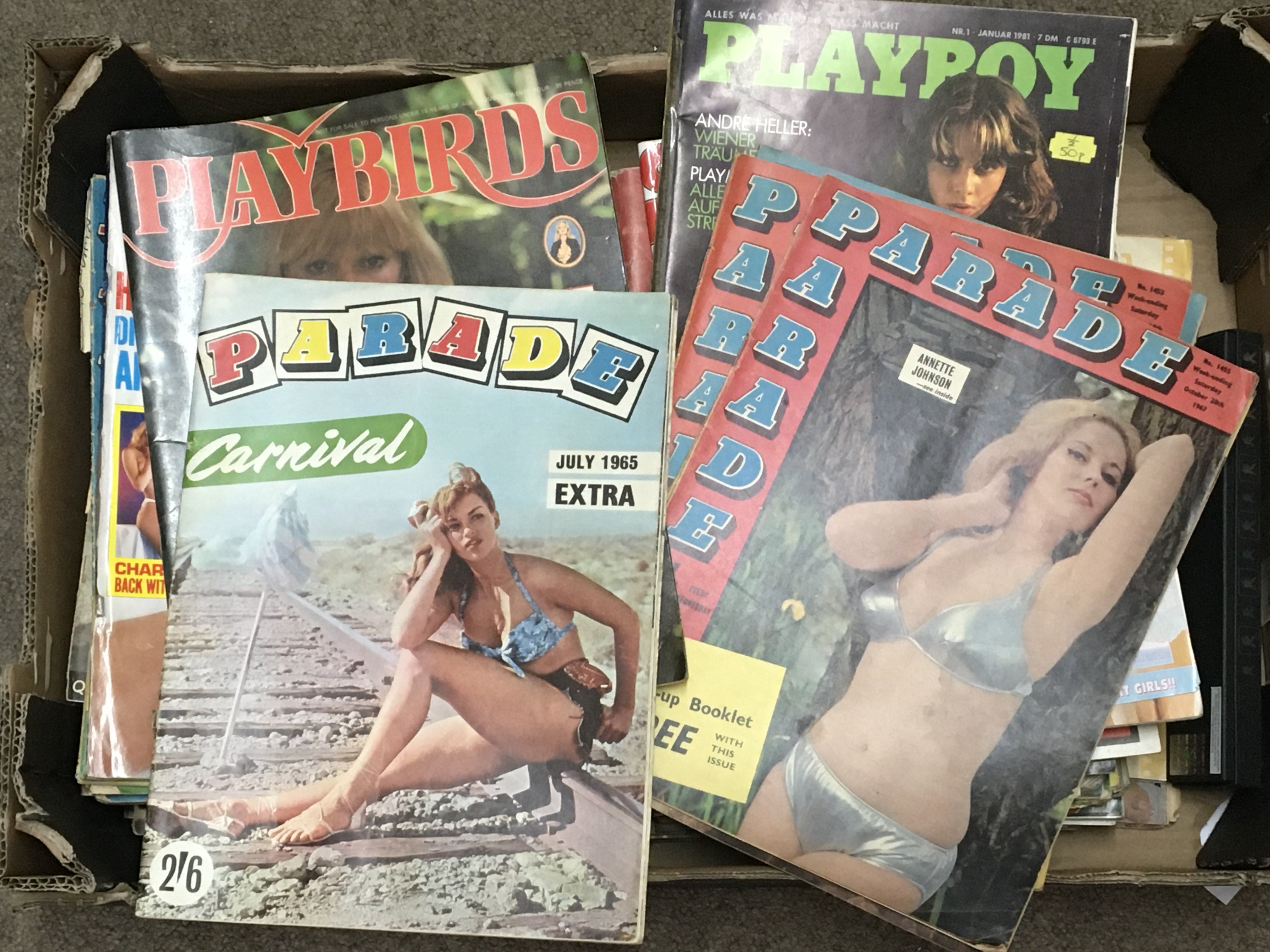 A box containing a collection of adult magazines Playboy, Parade, etc
