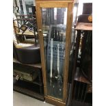 A tall square shop display cabinet fitted with four glass selfs and four glazed sides. 200 cm by