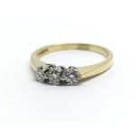 An 18ct yellow gold and three stone diamond ring, approx 0.25ct, ring size approx O