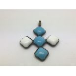 An antique blue and white stone cross pendant, approx width 6cm.