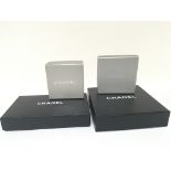 A collection of four original Chanel boxes black and silver four different sizes 17x 4cm and
