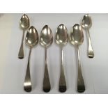 Six Georgian silver spoons including four serving spoons, various makers, approx 324g.