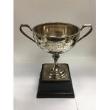 A silver trophy cup on stand, Birmingham hallmarks, approx total height 23cm and approx weight