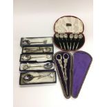 A cased set of six silver coffee spoons, cased grape scissors, silver plated spoons etc.