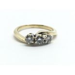 An 18ct yellow gold and three stone diamond ring, approx 0.30ct,