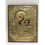 A silver icon with painted faces of Mary and Jesus, approx 21cm x 26cm.