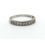 An 18ct white gold solitaire diamond half eternity ring, approx 0.33ct, size approx J/K