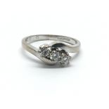 An 18ct white gold, three stone diamond ring, approx 0.25ct, ring size approx M