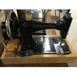A singer sewing machine in original case .
