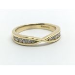 An 18ct yellow gold and twelve diamond half eternity ring, approx 0.25ct, ring size approx M/N