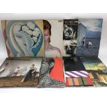 A large bag of vinyl records including The Rolling Stones, The Who, David Bowie and many more.