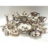 A collection of Masons Ironstone ceramics consisting of candlestick holders, jugs, bowls etc, in