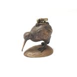 A small and unusual table lighter in the form of a kiwi