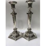 A pair of Edwardian silver plated candle sticks 30 cm .