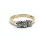 An 18ct yellow gold and three stone diamond ring, approx 0.50ct, ring size approx M