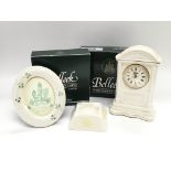 A Belleek porcelain clock with box, a photo frame with box and an ashtray