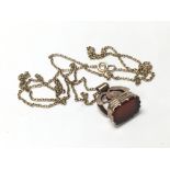 A 9ct gold and Carnelian fob on chain, total weight approx 5.4g