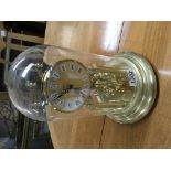 A Kein brass and glass dome anniversary clock.