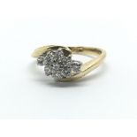 An 18ct yellow gold and nine stone diamond ring, approx 0.33ct, ring size approx J/K