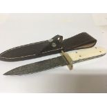 A Quality Bowie type hunting knife with camel bone handle and Damascus steel blade possibly early