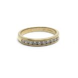 A 9ct yellow gold half eternity ring having a row of 10 diamonds, approx 0.33ct, ring size approx K