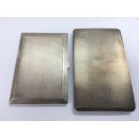 Two silver cigarette cases with engine turned decoration and gilt interiors, different assays.