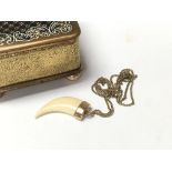 A Victorian 18ct gold and claw pendant with 9ct gold chain