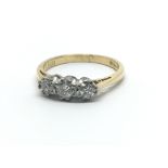 An 18ct yellow gold and three stone diamond ring, approx 0.33ct, ring size approx J/K