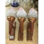 3 Art Deco copper and Bakelite wall sconces with glass flame shades..