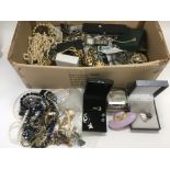 A box of costume jewellery including watches.