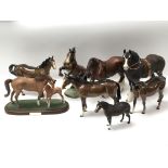 A collection of eight Beswick horses of various sizes
