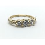 An 18ct yellow gold and CZ ring, size approx M/N