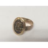An Antique 9 carat Gold Mourning ring With an oval with gold initials. Weight 3g.
