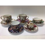 A collection of five cabinet cups and saucers including Dresden and Derby.