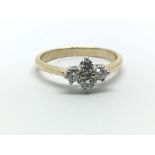 A 9ct yellow gold ring with four diamonds, approx 0.40ct, ring size approx O/P