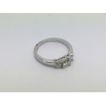 An 18ct white gold princess cut diamond trilogy ring, diamonds approx 0.75ct, approx 3.4g.