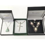 A silver Jesus on cross pendant on chain, a Jade Buddha on silver chain and an 800 silver 1950â€™s