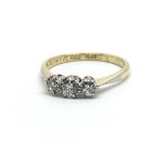 A vintage 18ct yellow gold three stone diamond ring, approx 0.20ct, ring size approx L/M