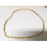 A High grade gold necklace indistinctly marked and possibly 22carat gold with ball and circular link