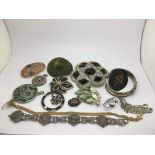 A collection of vintage costume jewellery comprising mainly brooches.