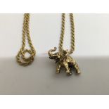 A 9 ct gold chain with attached pendant in the form of a elephant. 24 grams