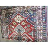 A large Persian wool rug 286 x 195cm