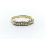 An 18ct yellow gold seven diamond half eternity ring, approx 0.55ct, ring size approx M