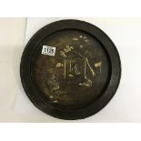 A Japanese bronze plate with raised and gilt decoration, impressed signature to reverse. 28cm