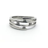 A 9ct white gold ring, with four small diamonds, ring size approx M/N