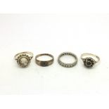 Four gold rings of various designs, approx 10.5g.