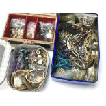 Three boxes containing a collection of costume jewellery including bracelets, necklaces and
