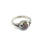 A vintage silver and enamel cherub ring, approx size N-O.